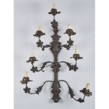 APPLIQUE a sette luci in ottone e rame con struttura in ferro. Italia XIX secolo Misure: h cm 75