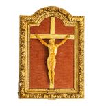 CRISTO crocifisso in avorio (cm 35) entro cornice in legno intagliato e dorato. Francia XIX secolo