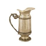 CARAFFA in argento sbalzato (g. 705) (usure e mancanze). Italia XX secolo Misure: h cm 24