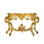 CONSOLE stile Luigi XV in legno e pastiglia dorata ad oro zecchino. Italia XIX secolo Misure: h cm