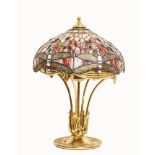 LAMPADA in ottone con boccia stile Tiffany, vetro policromo. Francia XX secolo Misure: h cm 59