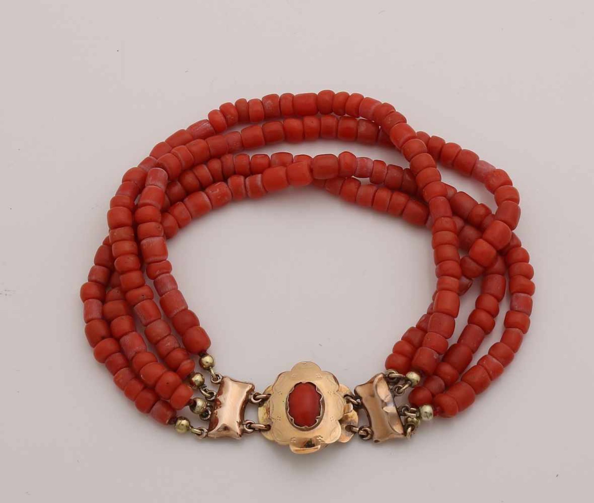 Bracelet of red coral with the yellow gold clasp, 585/000. Bracelet with 4 rows of red coral, some