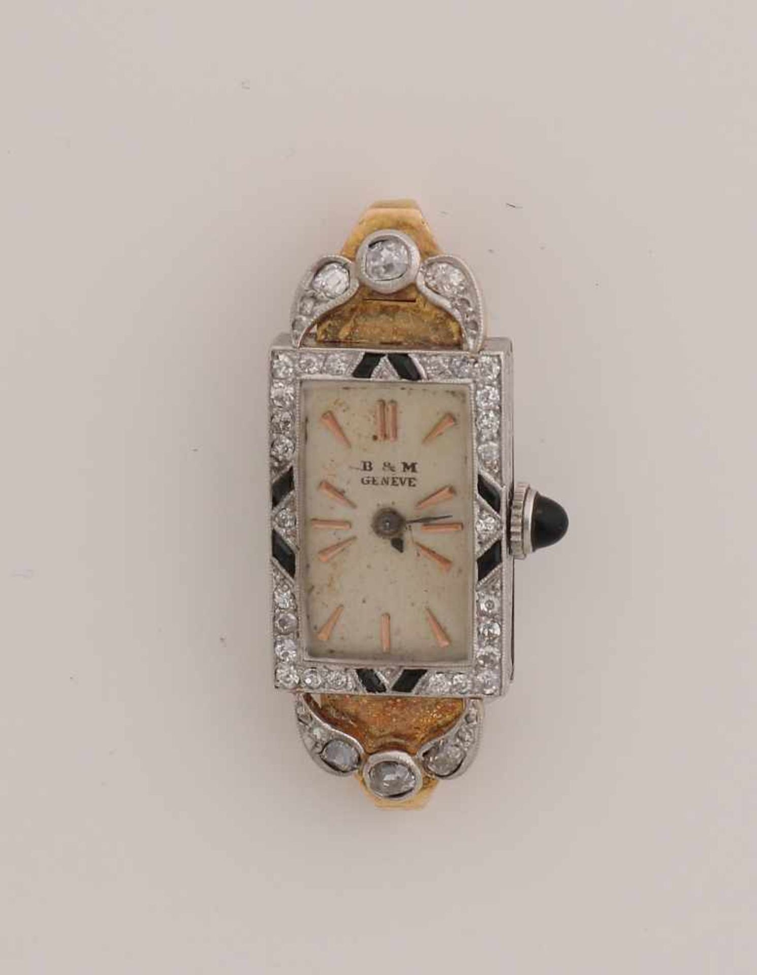 Platinum watch, Art Deco, with gold and among other diamonds and simili stones. Rectangular carved