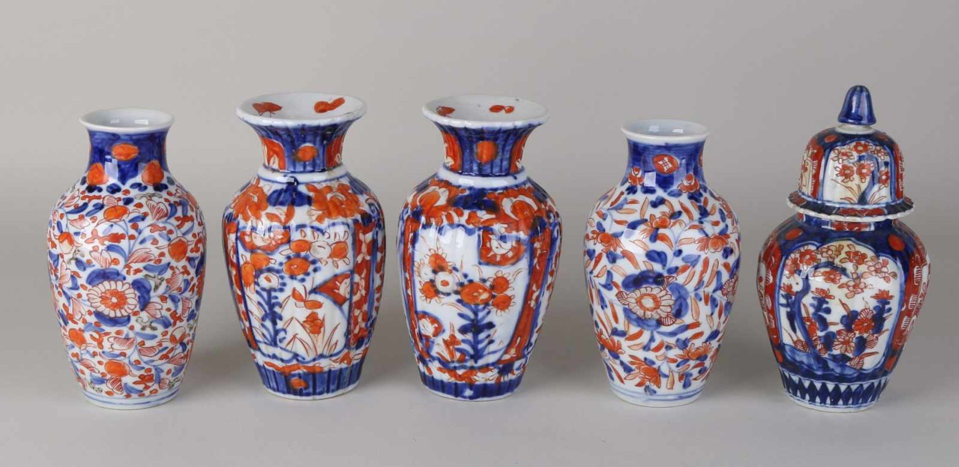 Five antique Imari porcelain vases. Two times set + one time loose vase. One chip bottom cover.