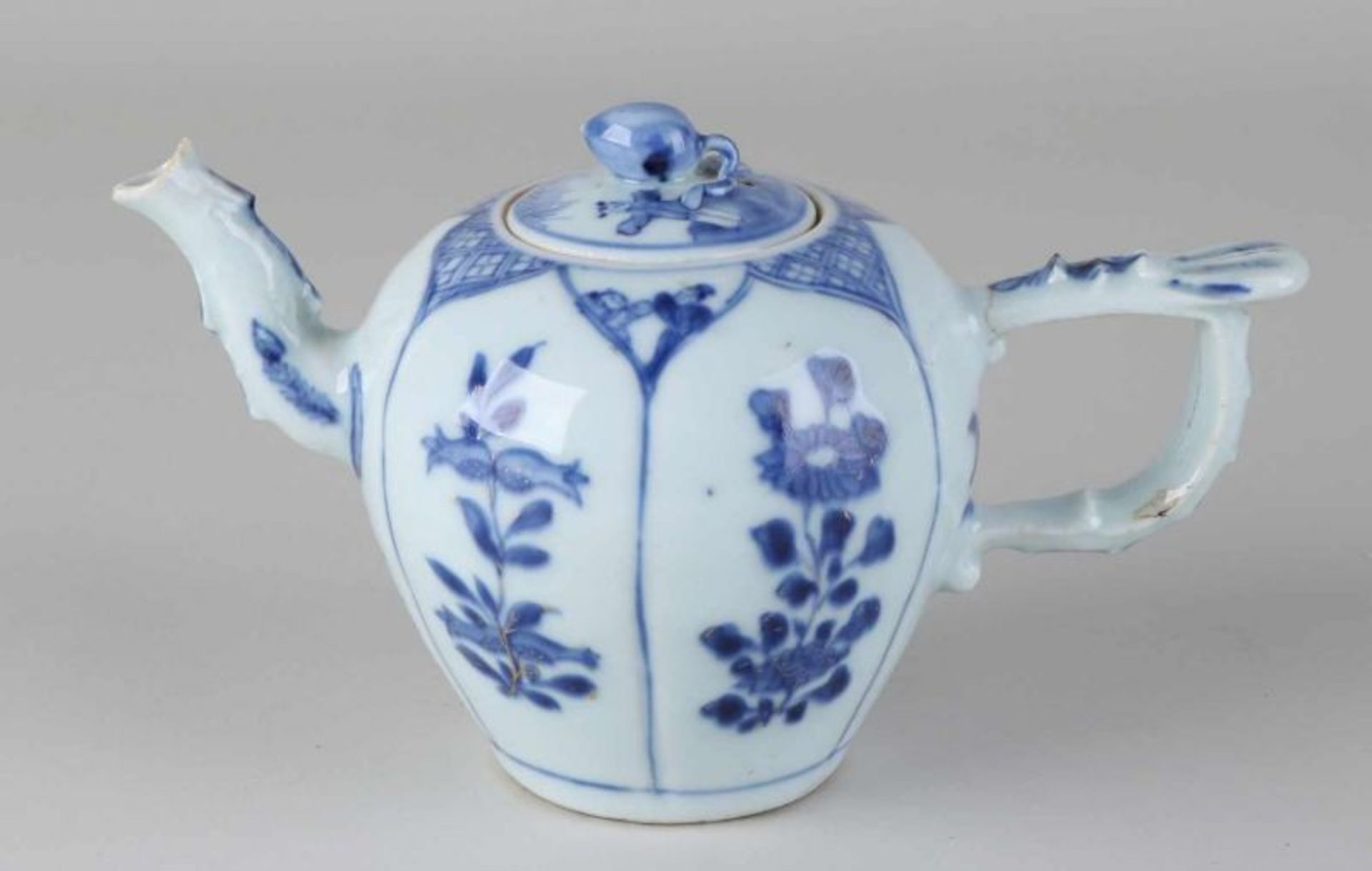 Rare 17th century Chinese Kang Xi porcelain teapot with zots on lid and floral decor. Hairline
