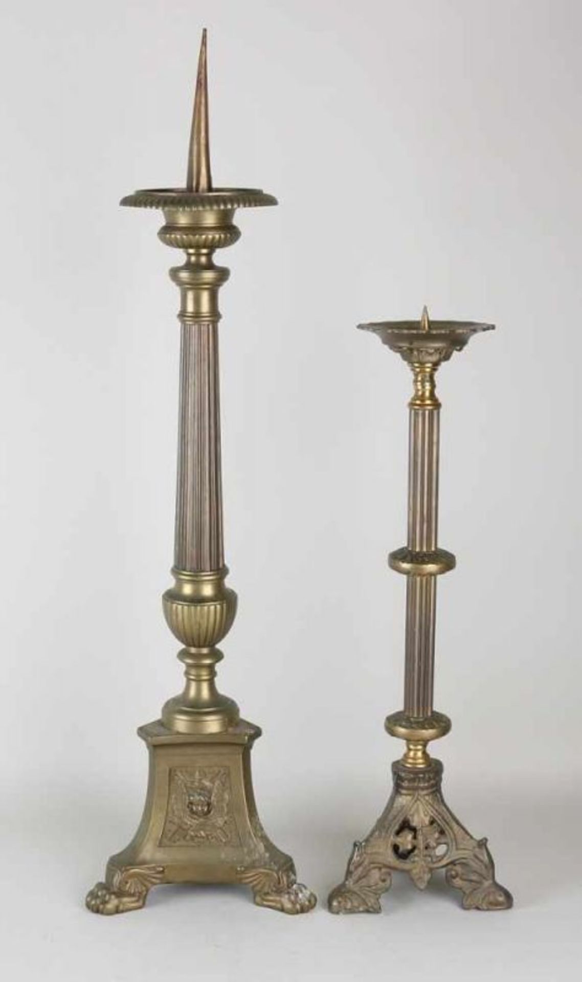 Two church brass candlesticks. Once Neo Renaissance, 19th century. Once Neo Gothic, 20th century.