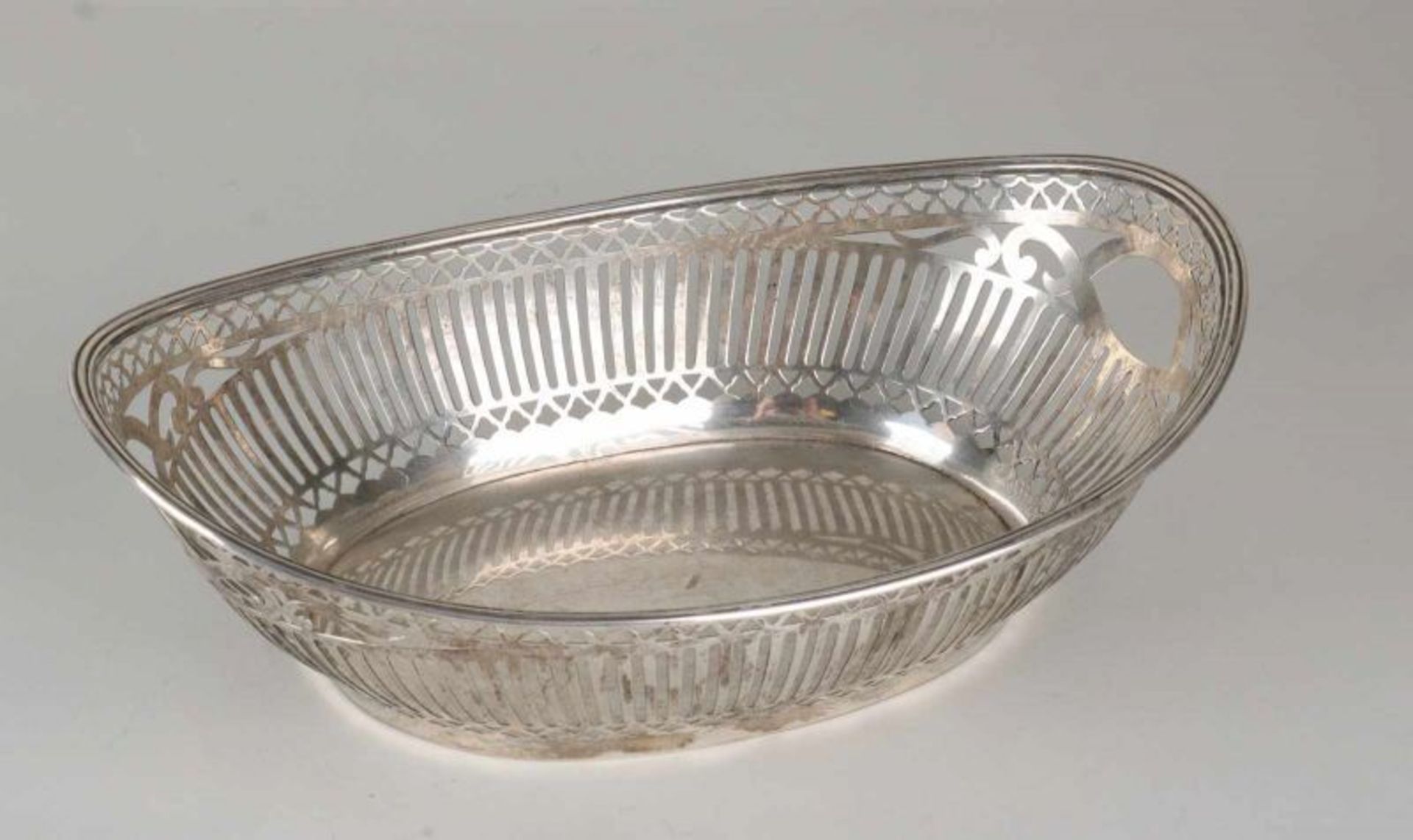 Silver bread basket, 835/000, oval model with sawn pattern with bars and contoured triangles, with