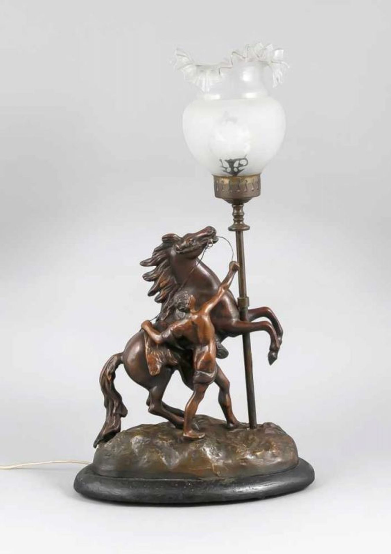 Antique French composition metal table lamp with horse driver. To Coustou. One leg of hairline.