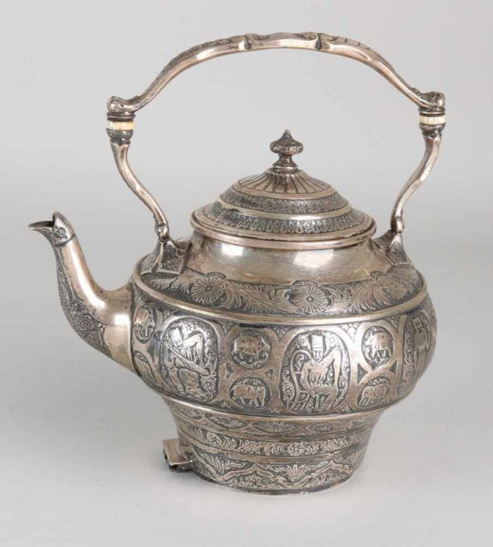 Antique special silver jug with handle and spout. Decorated with processing and various engraving