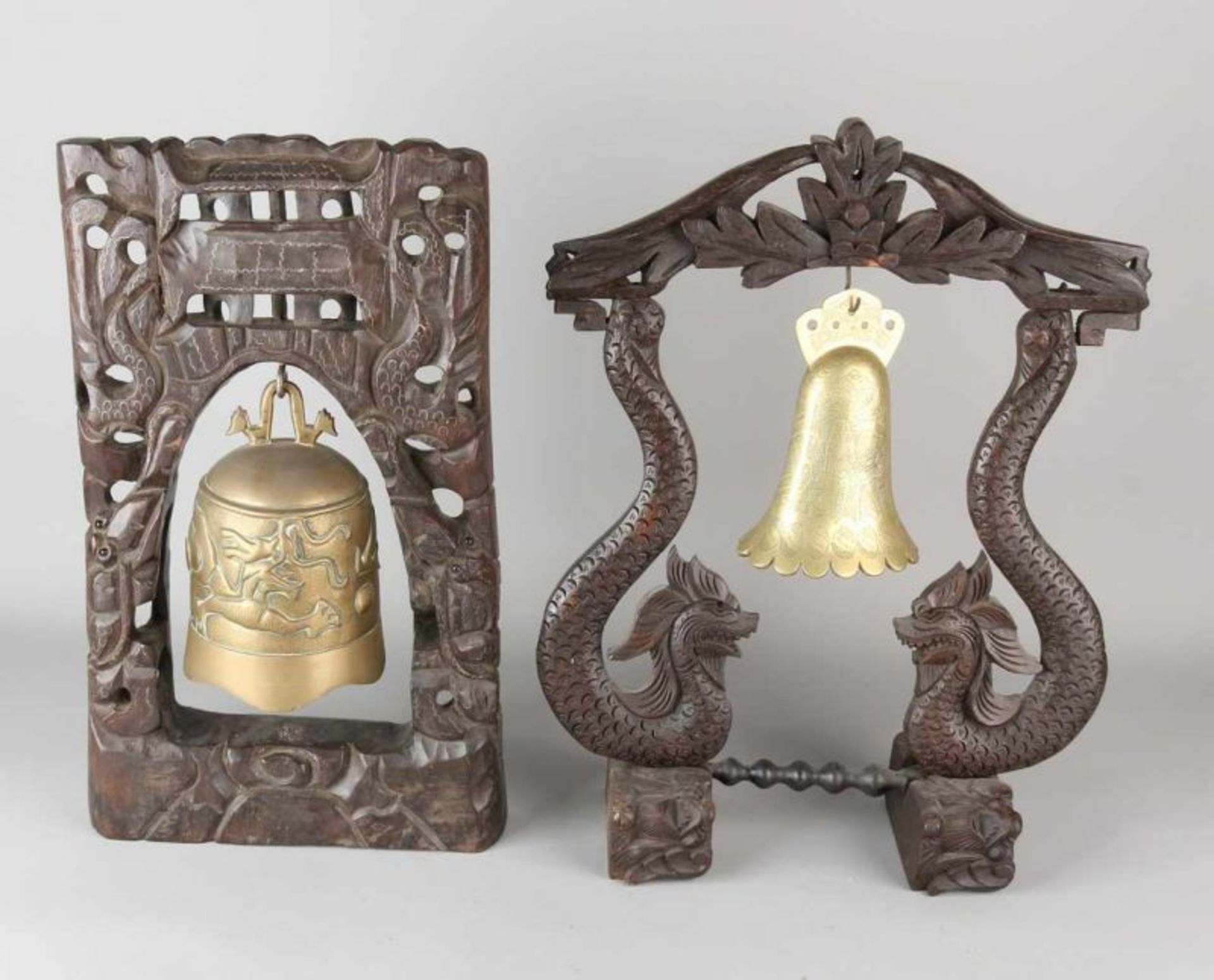 Two Asian bronze table bells with carvings. 20th century. Dimensions: 43 - 45 cm. In good