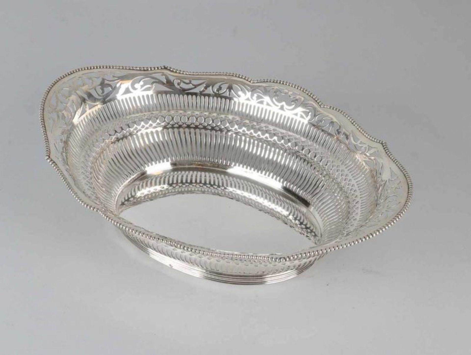 Beautiful capital oval 835/000 silver bread basket with bars, circles and floral contoured top