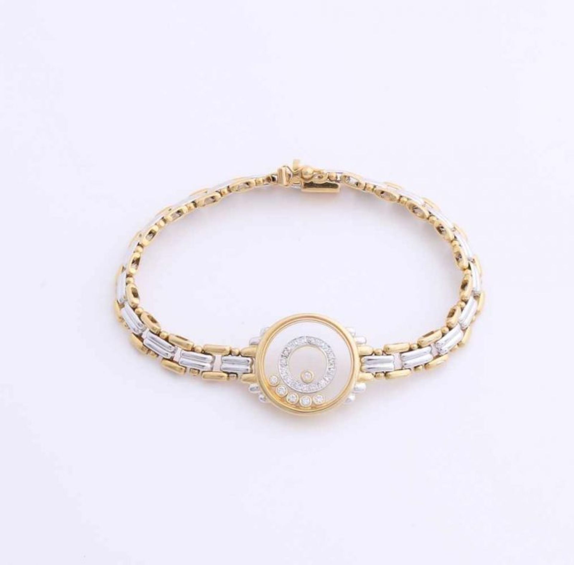 Gold bracelet, 750/000, with diamonds. Bracelet with links of white and yellow gold, decorated in