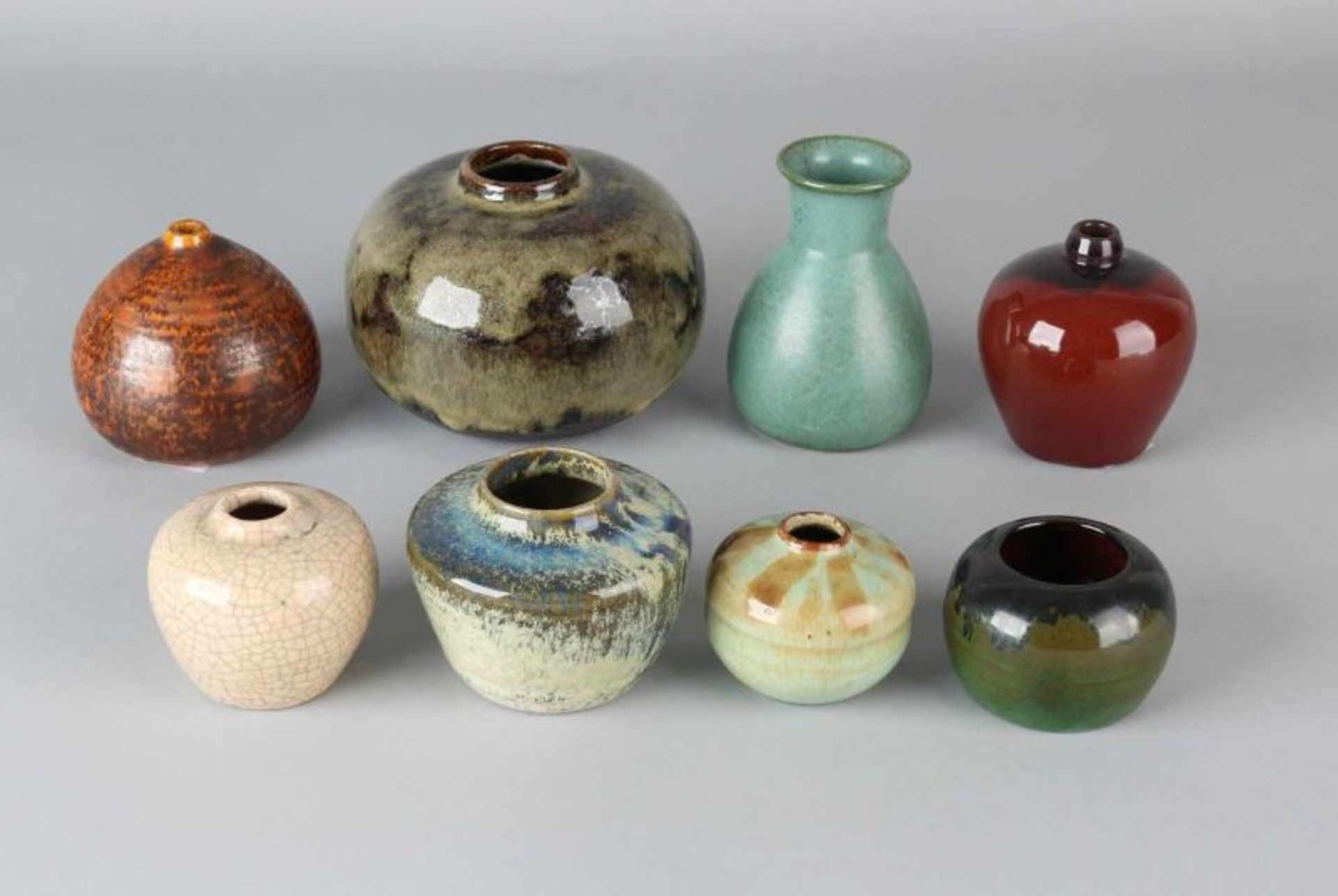 Collection of eight glazed ceramic ball vases. Various marked, including Texel. 20th century.