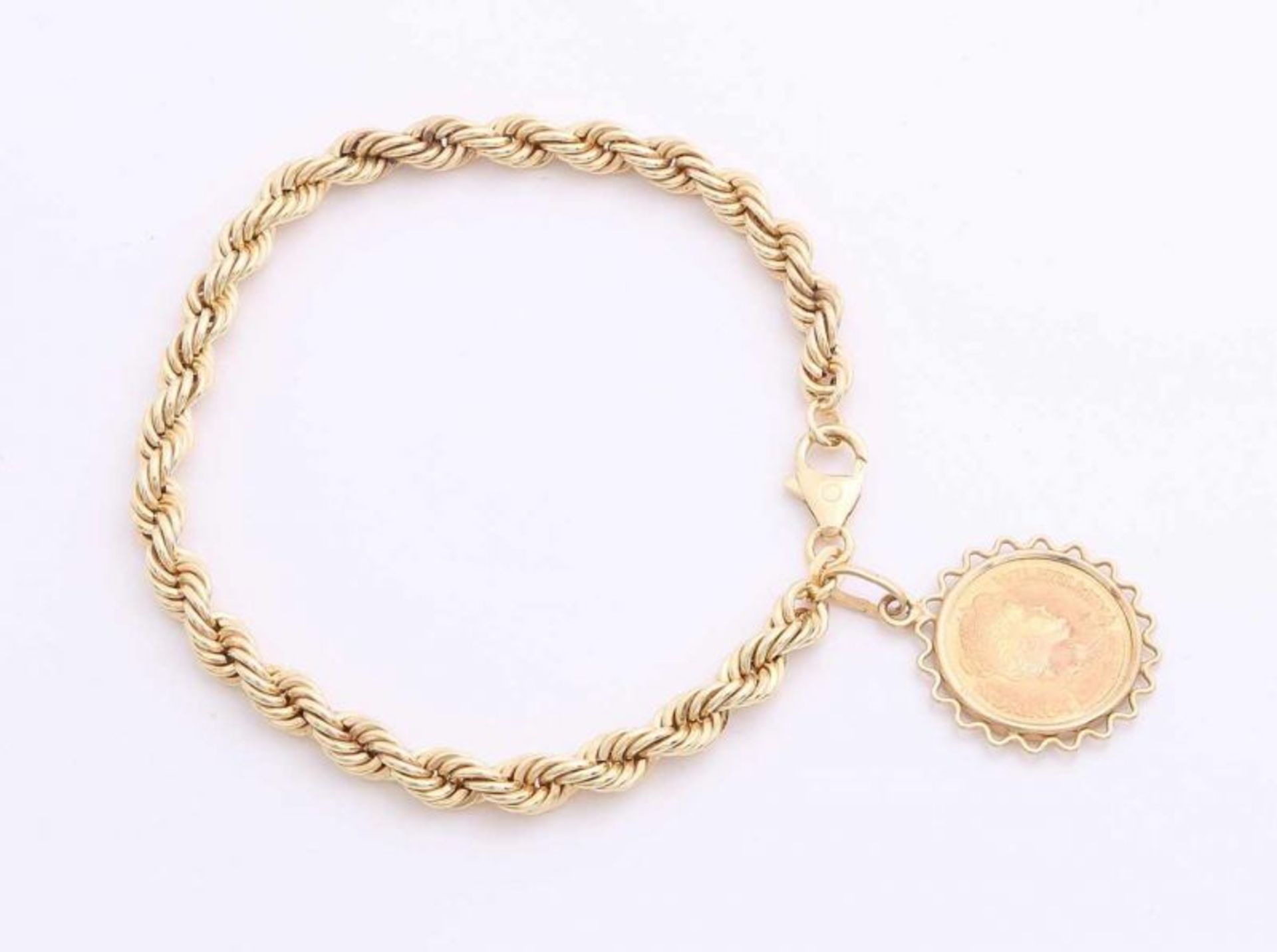 Yellow gold cord bracelet with gold coin, 585/000. Cord bracelet, ø 4.5 mm, with a carved coin