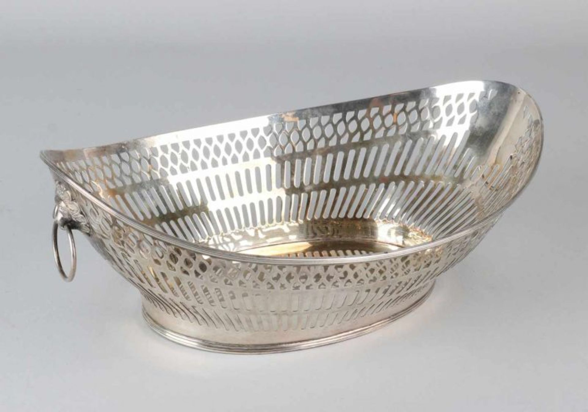 Silver bread basket, 835/000, oval model with sawn bar decoration, placed on an oval ring with