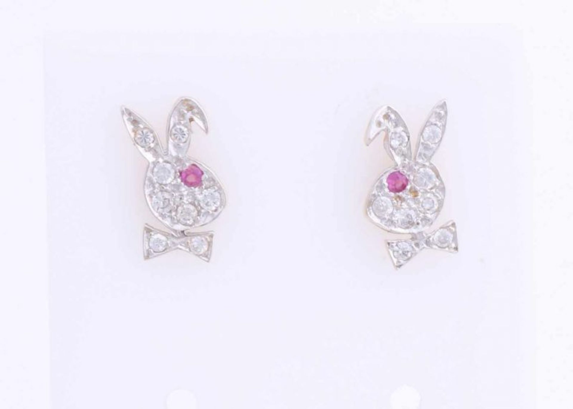 Yellow gold earrings, 585/000, in the shape of a rabbit's head, set with zirconia's and ruby. 11x6.
