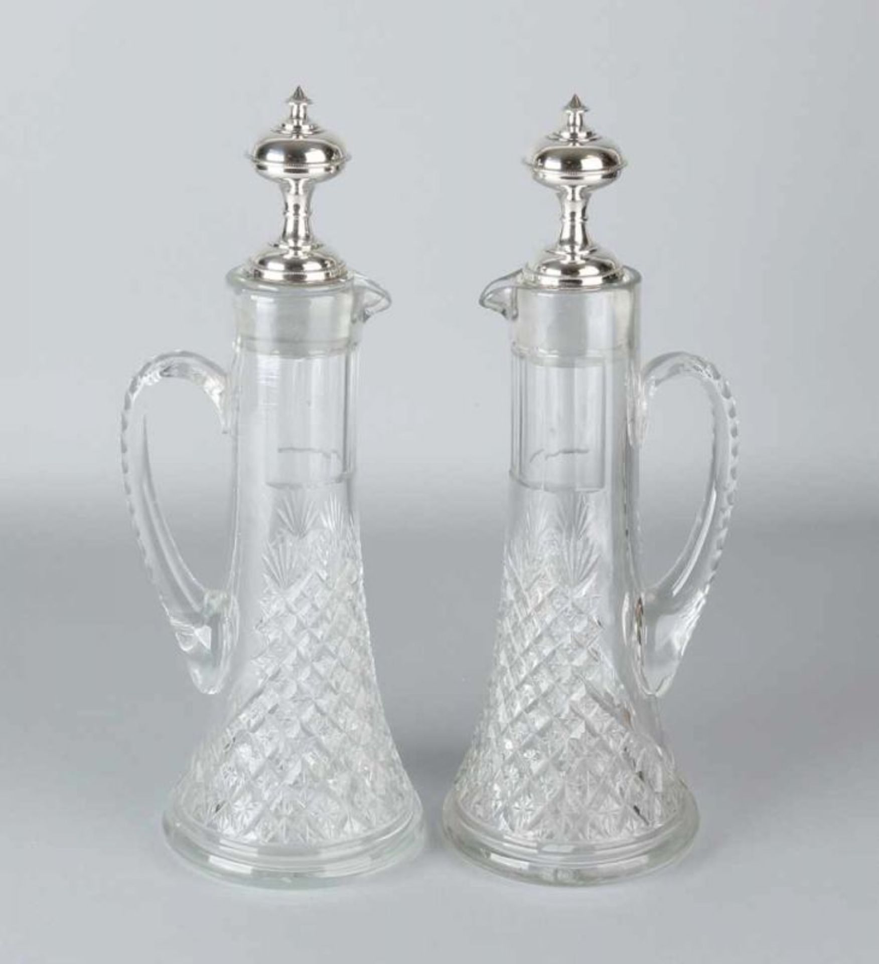 Set of carafes with silver, two crystal carafes with spout and handle, decorated with diamond and