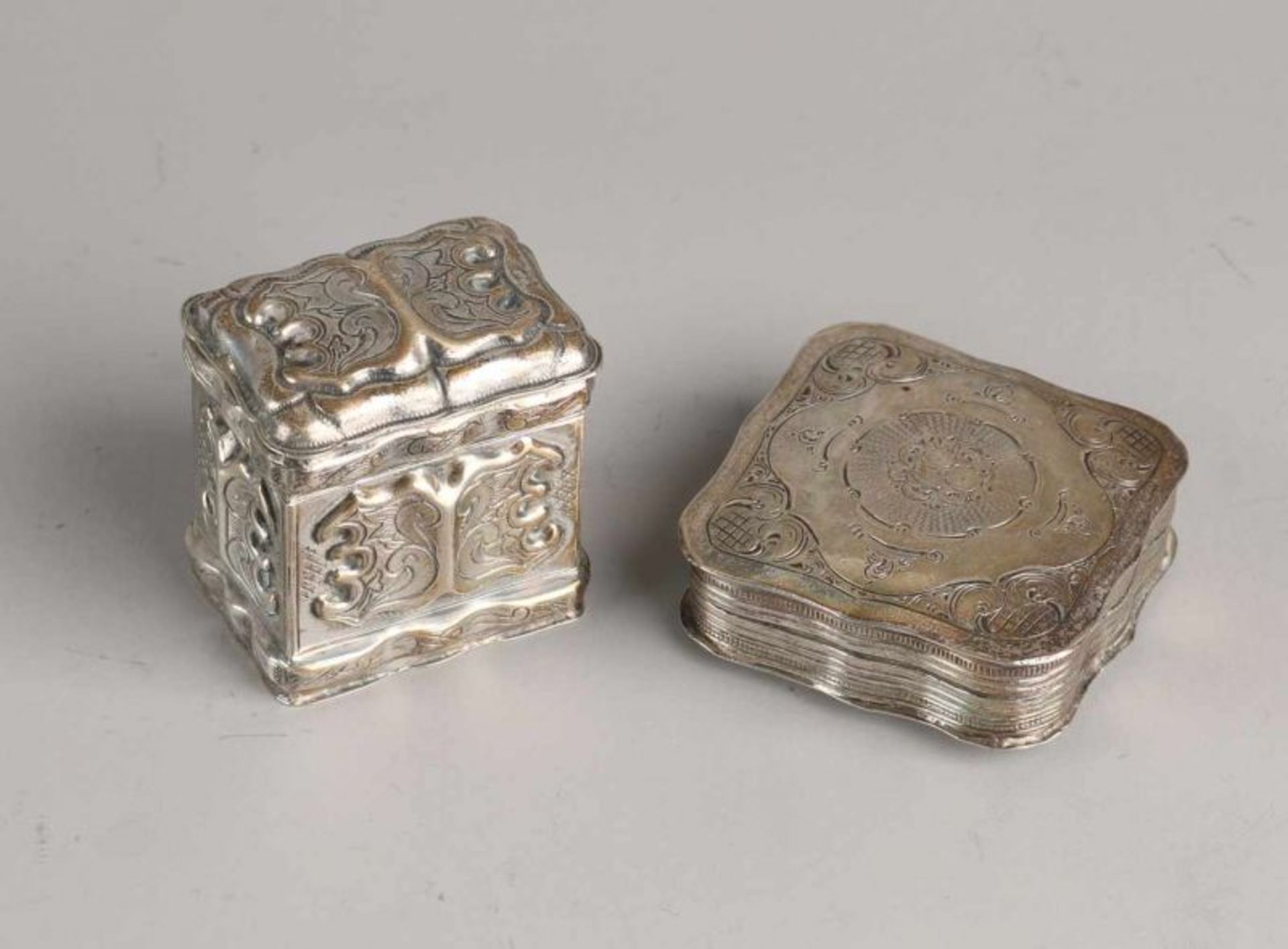 Two silver boxes, 835/000, a square contoured peppermint box decorated with engraving. MT .: Abraham
