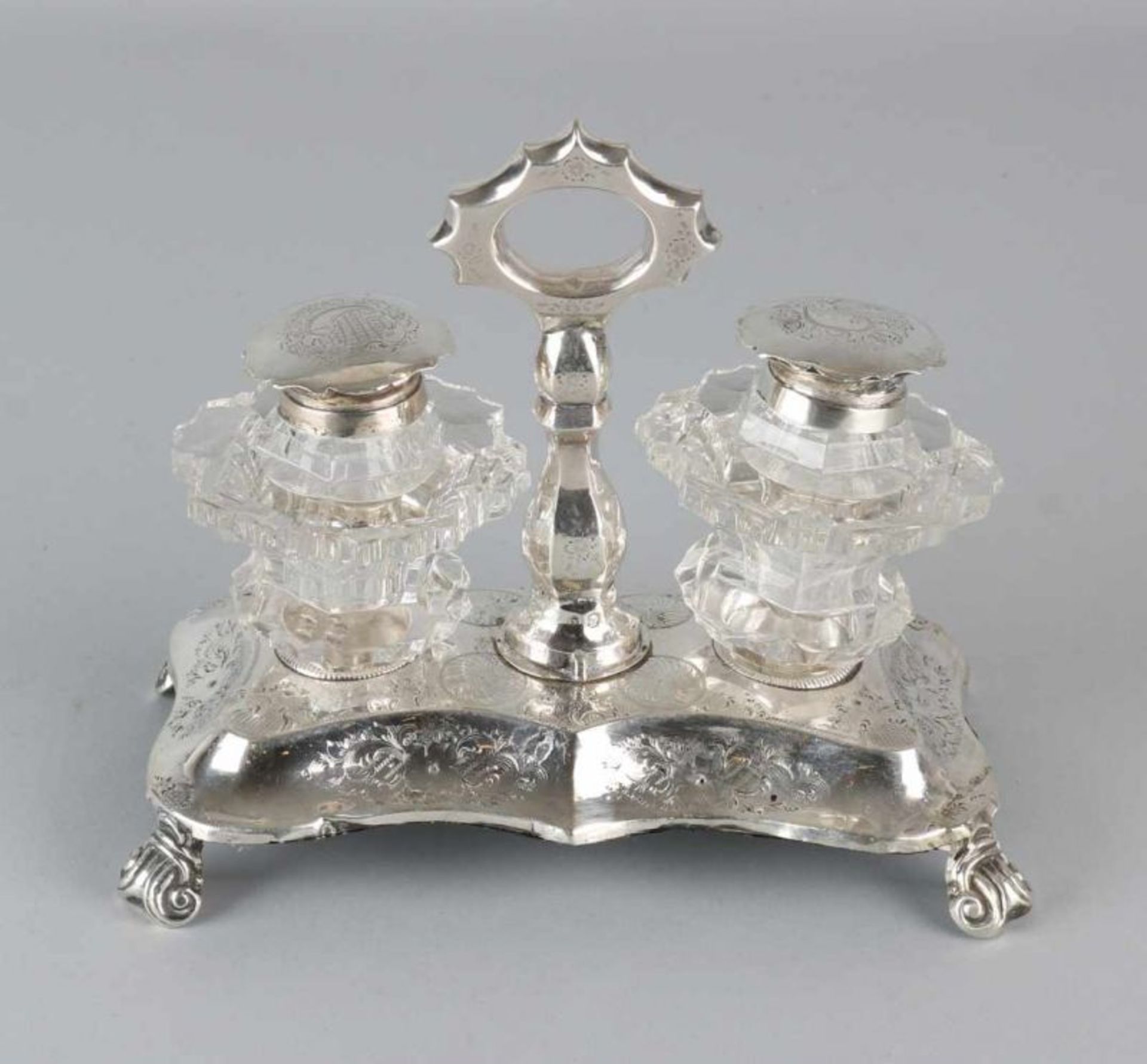 Ink set with silver holder, rectangular contoured with engraving, placed on 4 curled legs and a