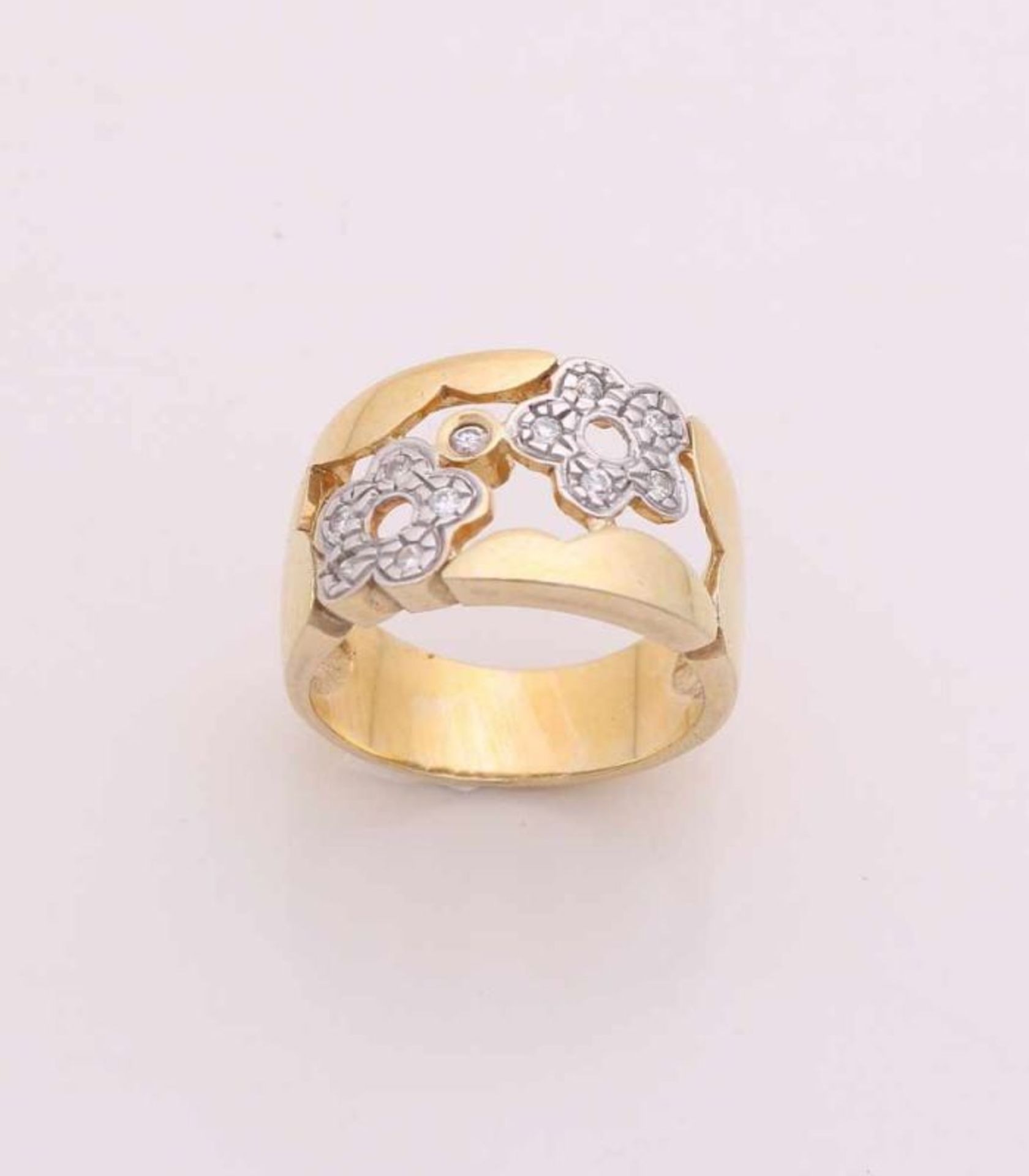 Gold on silver ring, 925/000, wide model decorated with sawn flowers set with zirconia's. width 13