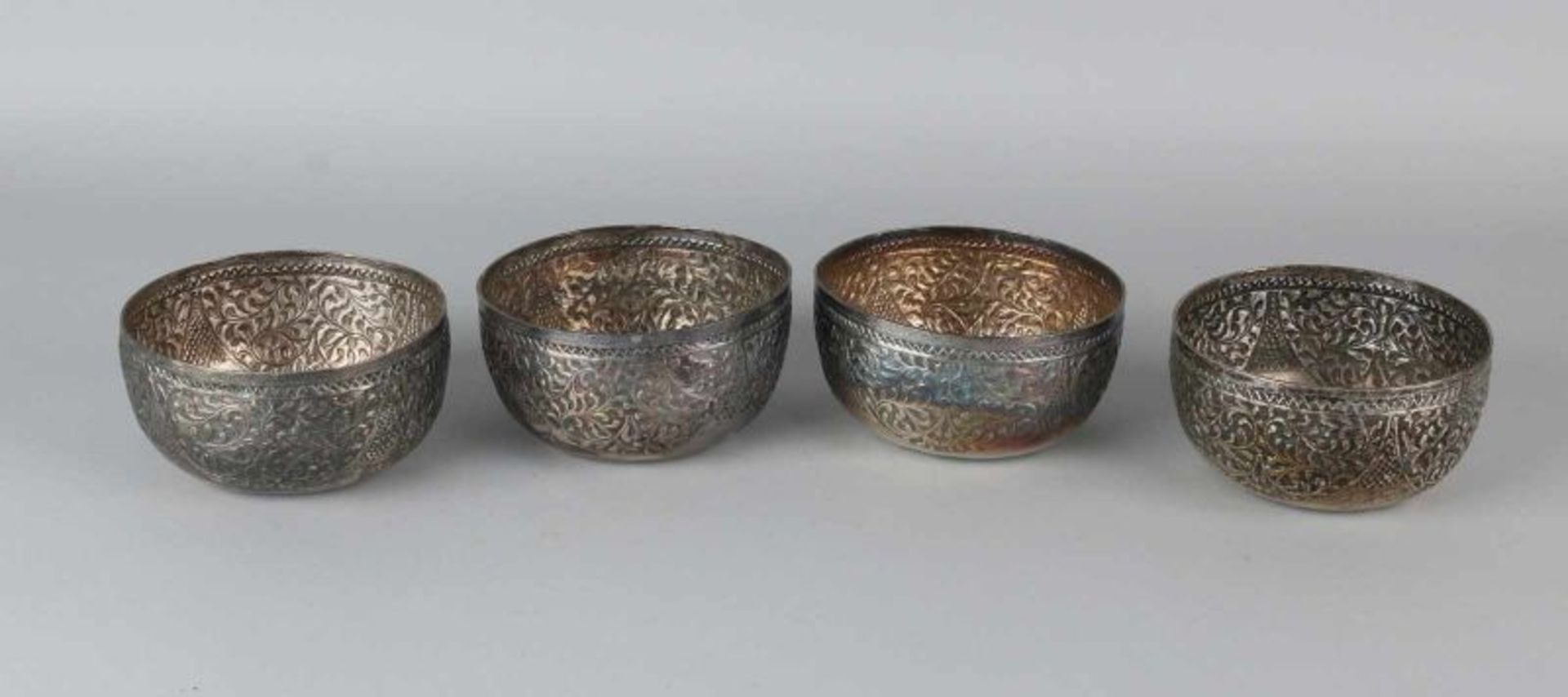 Four Colonial silver rice bowls, BWG, with driven patterns. ø 11x5.5 cm. approx. 239 grams. A bowl