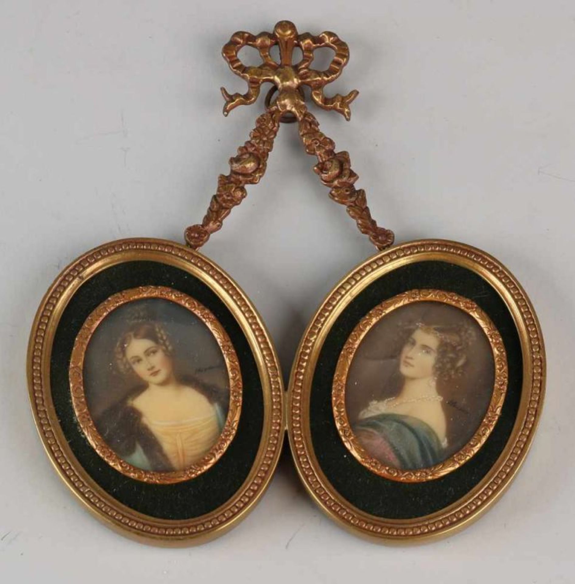 Two miniatures in brass frame. Louis Seize style. Women's portraits. Signed. Dimensions: 15.5 x 13 x