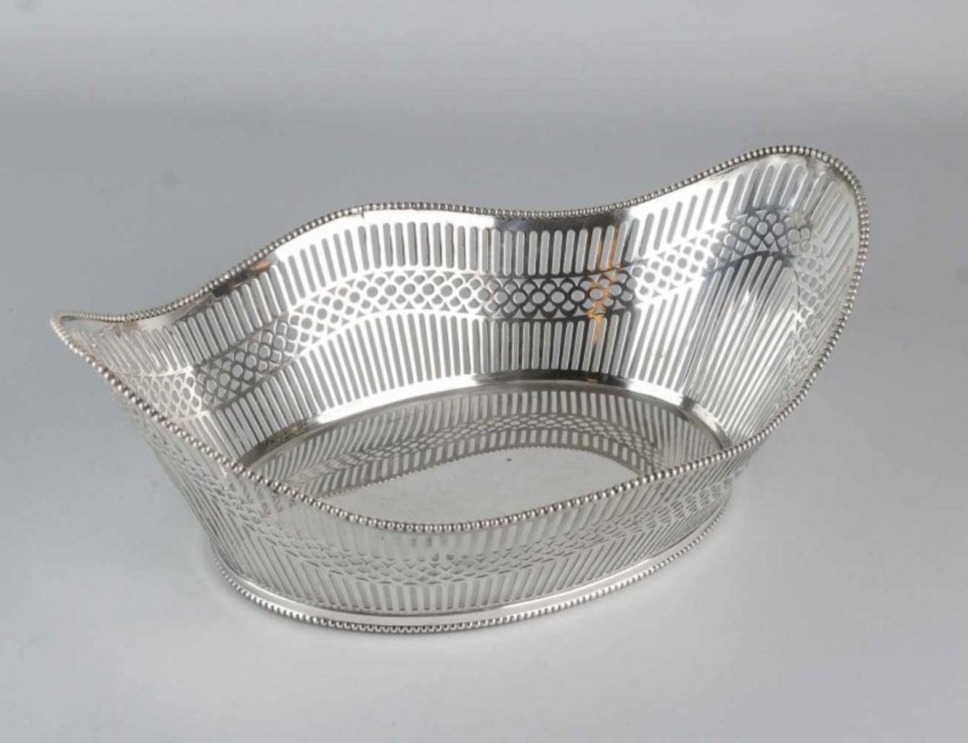 Silver bread basket, 833/000, Oval model with contoured border with pearl decoration. The basket has