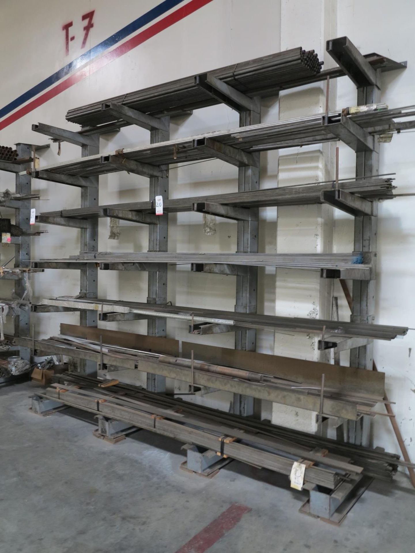 LOT - CONTENTS OF CANTILEVER RACK TO INCLUDE: MISC 10' & 12' USEABLE STEEL BAR, PIPE, ETC.