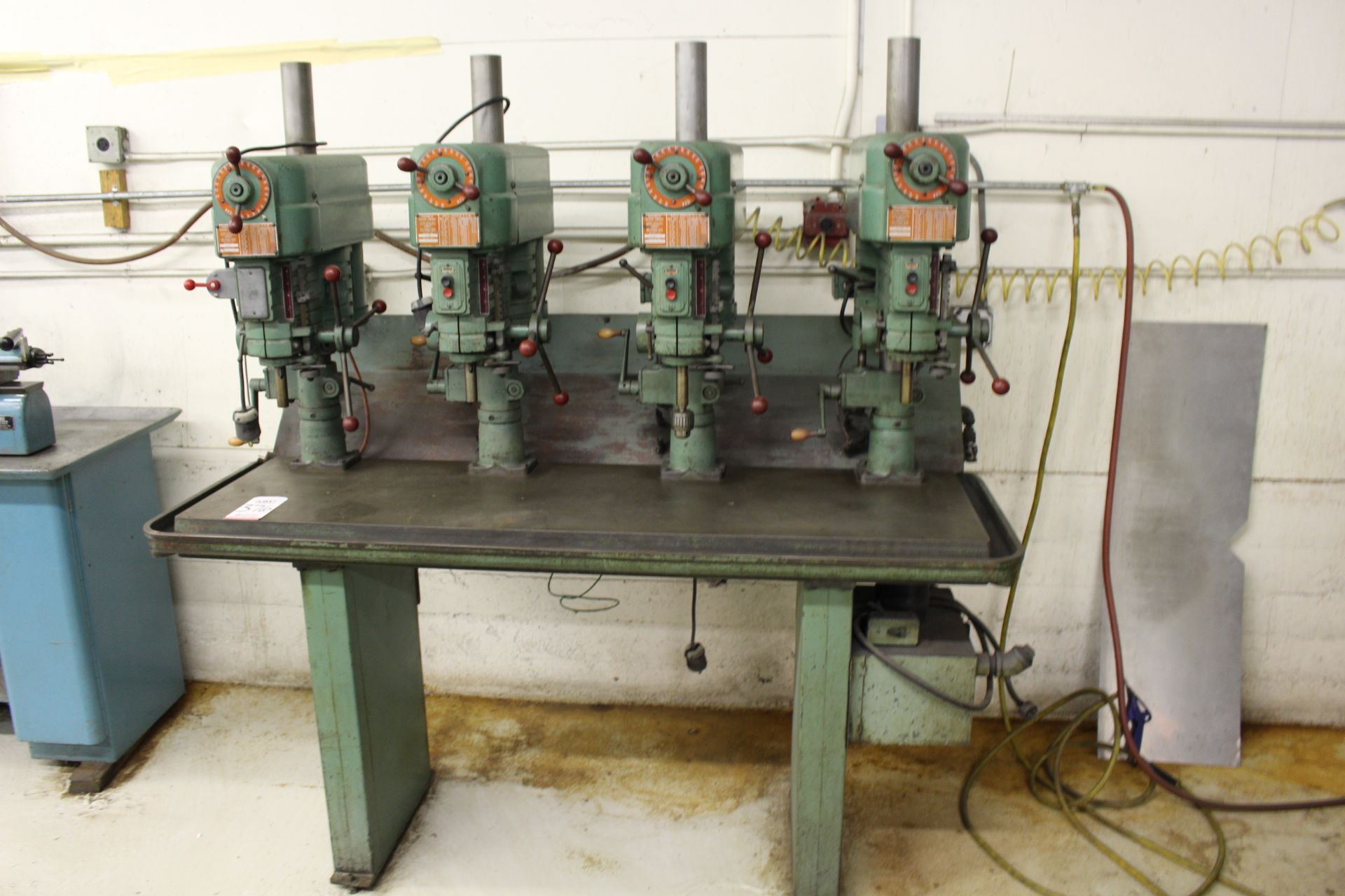 POWERMATIC 4-HEAD 14" SWING DRILL PRESS STATION, W/ (4) POWERMATIC 1100 DRILL PRESSES, COOLANT