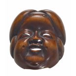 NETSUKE: OKAME-MASKE. Japan. 19. Jh. Buchsbaum. Höhe 4,7cm. Sign.: Gyokkô. Zustand A/B.