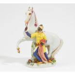 PORCELAIN FIGURINE OF MOOR TAMING HORSE. Meissen. 1924-1934. Model J.J. Kaendler. Porcelain,