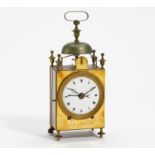 BRASS TRAVELING CLOCK, SO CALLED "CAPUCINE". France. Ca. 1820. Dilger a Vesoul. Brass. Enamel