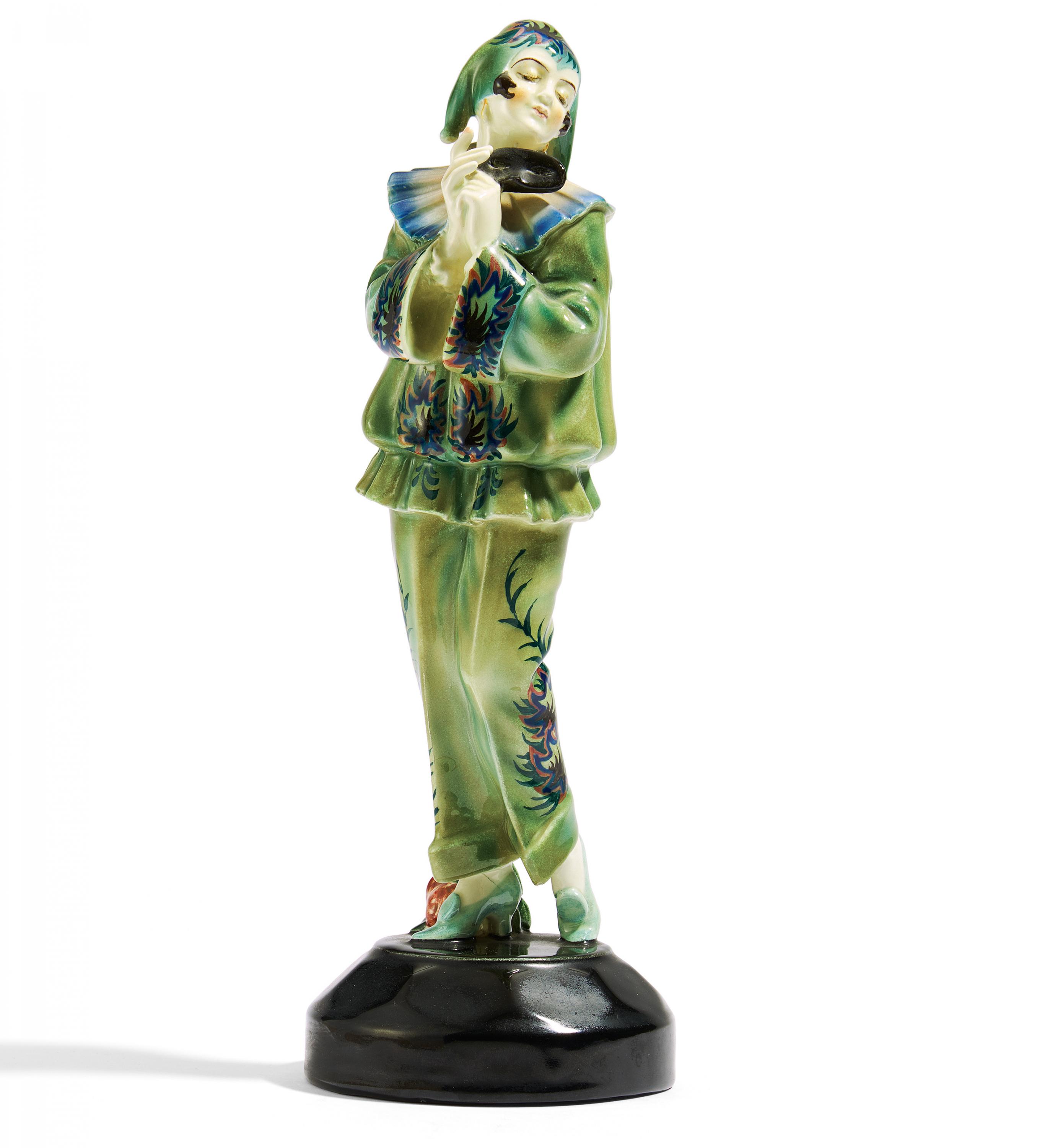 CERAMIC FIGURINE OF STANDING PIERETTE WITH MASK. Goldscheider, Friedrich. Vienna. Execution ca.