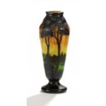CLUB-SHAPED GLASS VASE WITH EVENING LANDSCAPE. Daum Frères. Nancy. Ca. 1918-25. Acromatic glass with