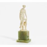 GODDESS DIANA WITH DOG CARVED IN IVORY ON WOODEN PEDESTAL. Germany. E. Ruisinger. Carved ivory.