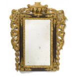 BAROQUE GILTWOOD MIRROR WITH DOOR. Germany. 1st half of the 18th century. Wood carved and partly