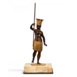 FIGURAL BRONZE CANDLE HOLDER 'AU BON SAUVAGE'. Paris. 19th century. Bronze partly patinated and