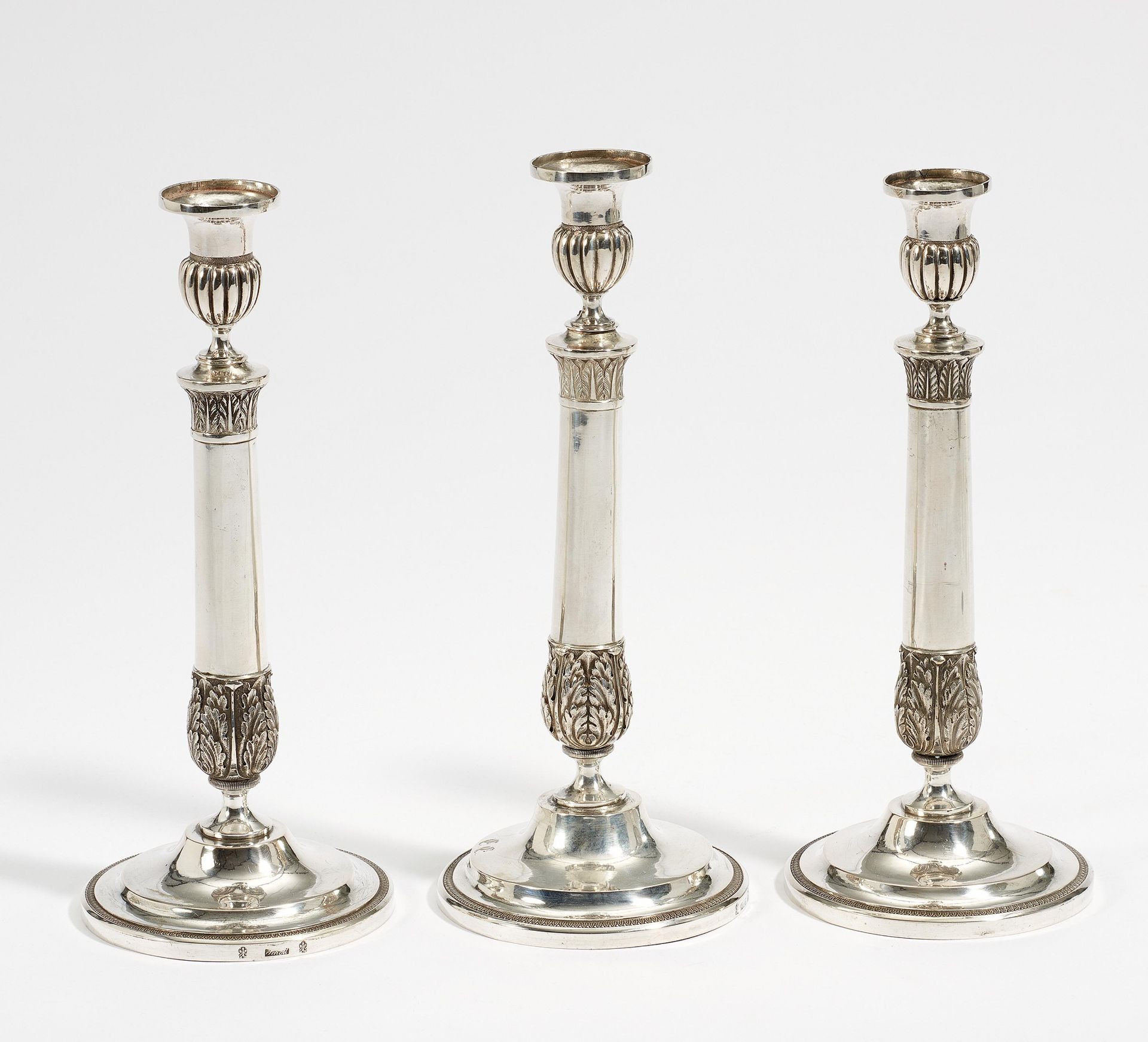 THREE SILVER CANDLESTICKS WITH ACANTHUS DECOR. Frankfurt a. M. Ca. 1820. Johann Martin Schott.