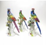 THREE PORCELAIN PARROTS WITH CHERRIES. Meissen. Model J.J. Kaendler. Porcelain, enriched in colours.