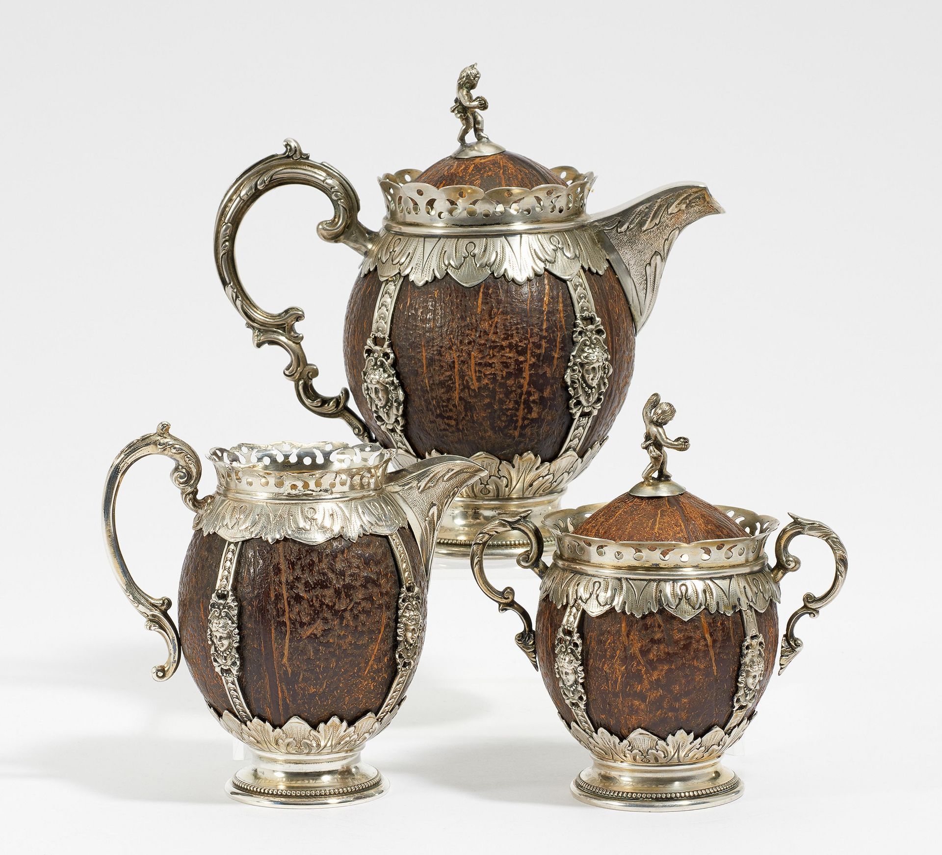 HISTORISTIC THREE-PIECE SILVER COCONUT SERVICE. Hanau. 20th century. Weinranck & Schmidt. Silver