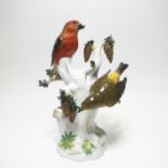 PORCELAIN SPRUCE TRUNK WITH TWO CROSSBILLS. Meissen. Before 1924. Model A. Ringler, 1863. Porcelain,