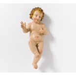 LYING TERRACOTTA FIGURE OF THE CHIST CHILD. Naples. 19th century. Terracotta painted in colours.