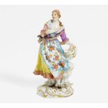 DANCING SHEPHERDESS. Meissen. Model F.E. Meyer. Porcelain, enriched in colours. Height 17,5cm.