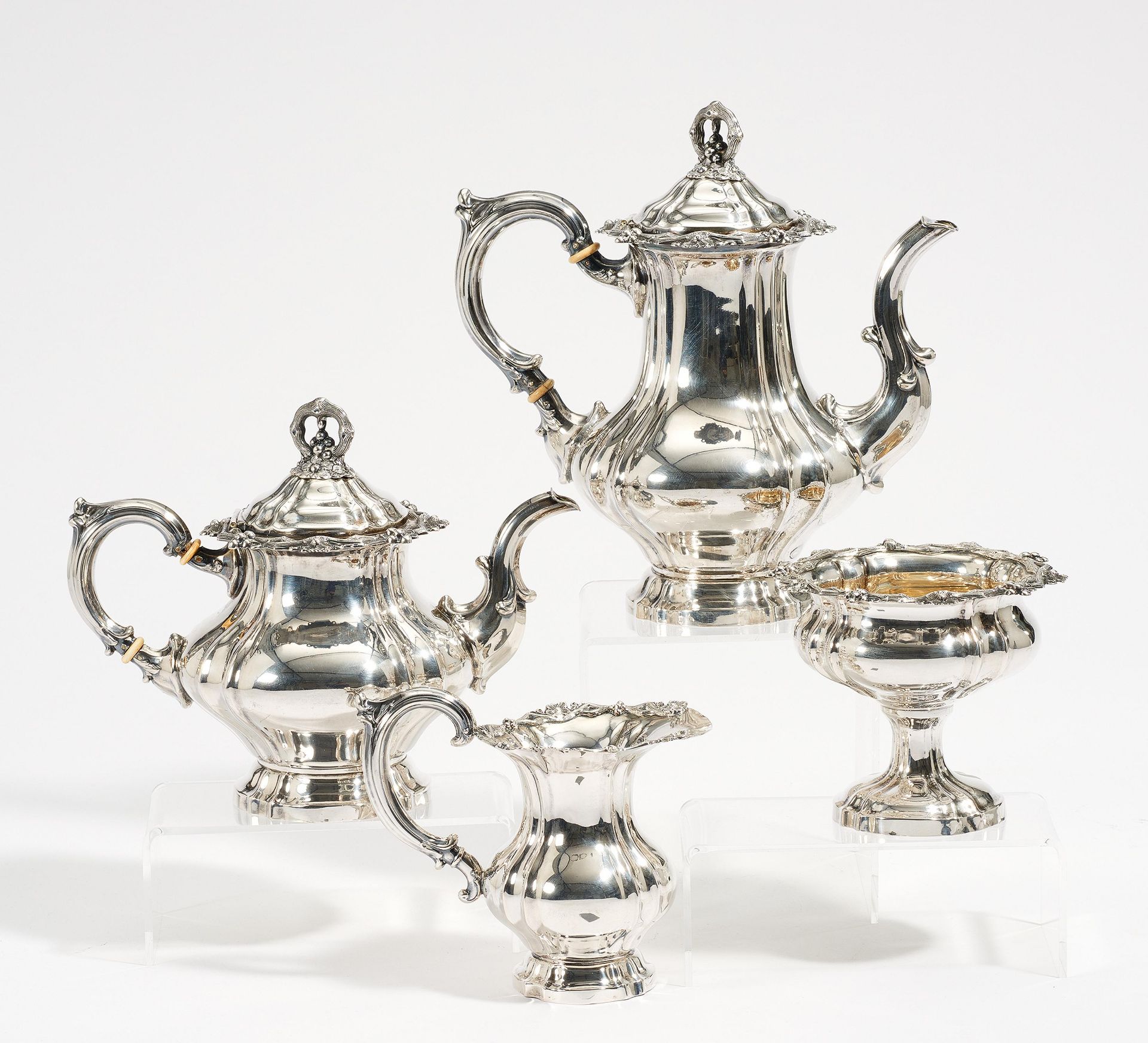 FOUR-PIECE SILVER COFFEE AND TEA SERVICE WITH VINE DECOR. Presumably Germany. Ca. 1900. Silver,