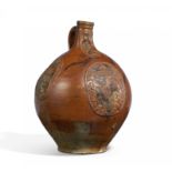 LARGE STONEWARE BARTMANN JUG WITH HERALDRY. Frechen. Ca. mid-16th century. Brown, salt glazed