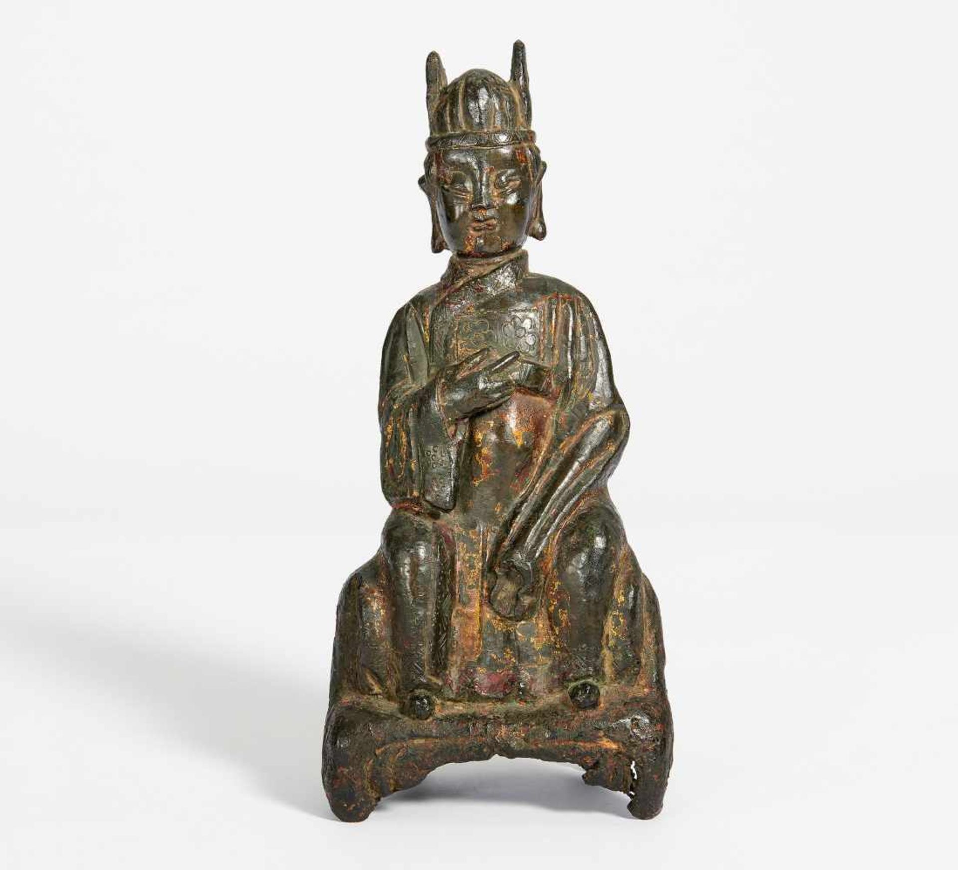 DAOIST SCHOLAR SITTING ON A THRONE. China. Ming dynasty. Bronze with dark patina and residue of