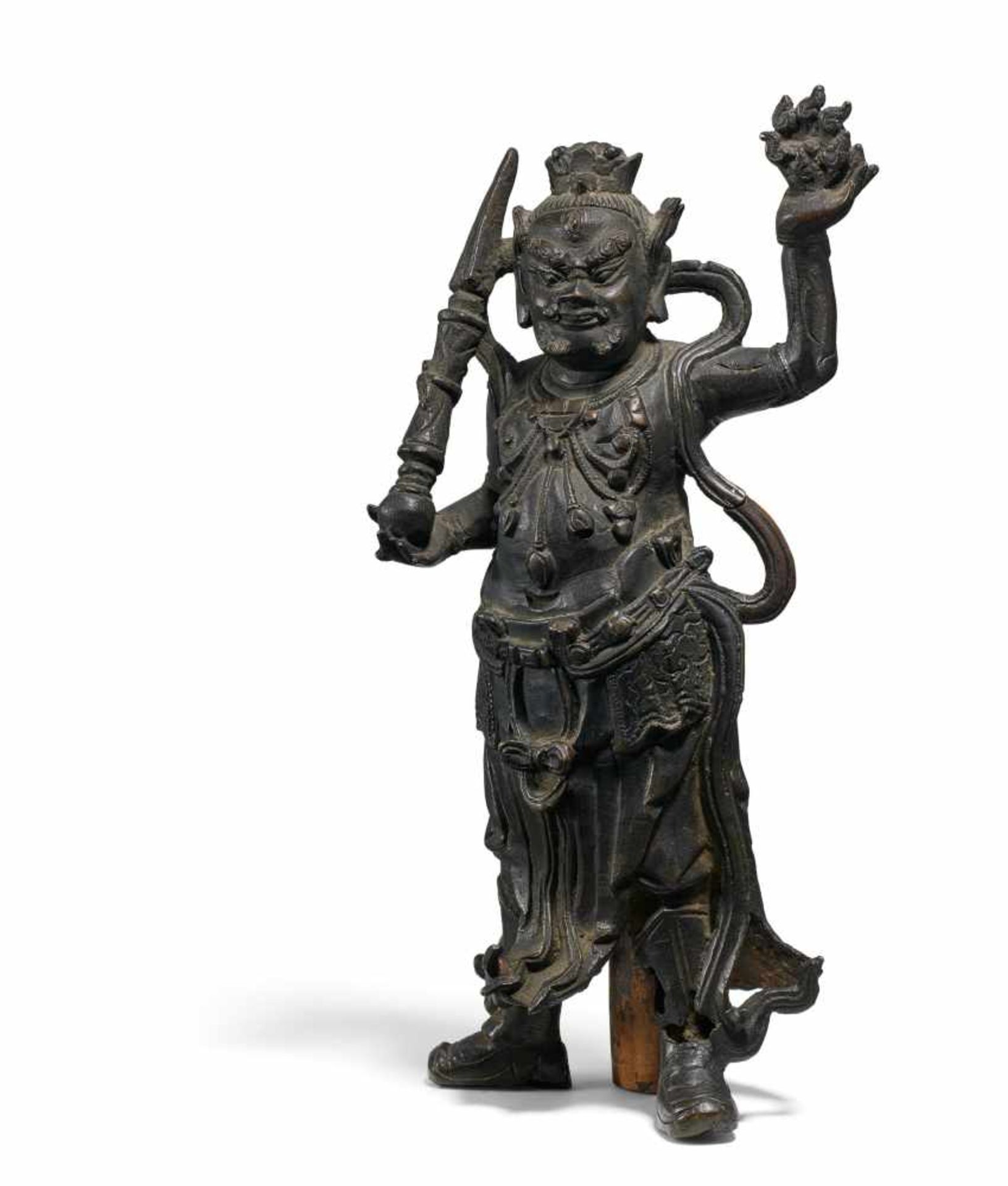 ATTENDANT OF BRAHMA WITH PHURBU AND FLAMING WHEEL. China. Ming/Qing dynasty. 17th/18th c. Bronze