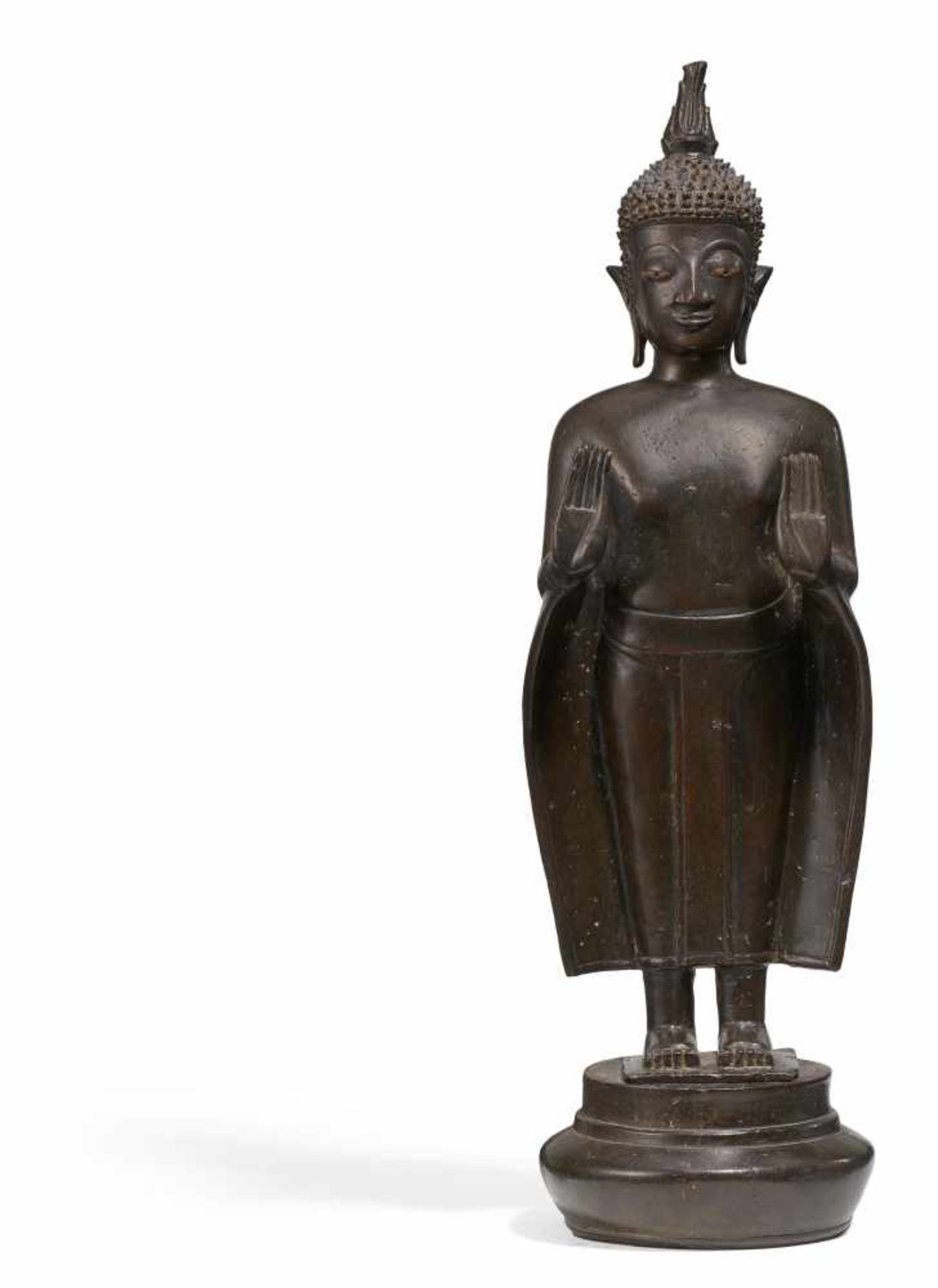 STANDING BUDDHA IN PHA BANG STYLE. Laos. 18th/19th c. Bronze with dark patina. Eyes inlaid in