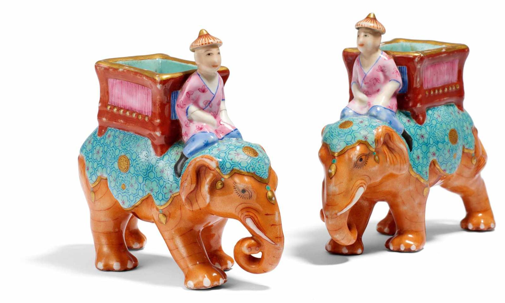 PAIR OF ELEPHANT WITH MAHOUT AND BASKET. China. Porcelain decorated in famille rose and gold. Strong