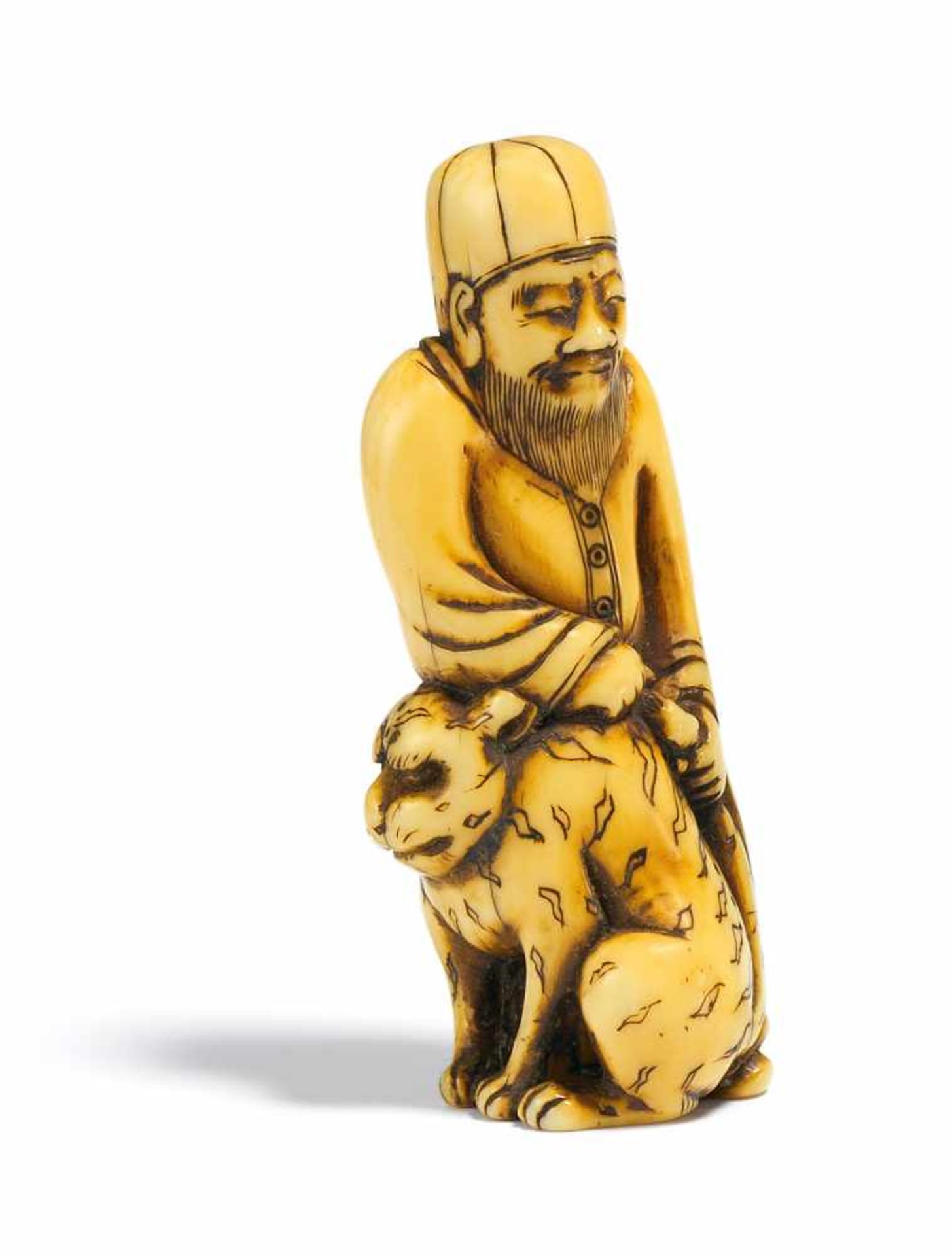 NETSUKE: WEST ASIAN MAN WITH TIGER. Japan. 18th c. Ivory with amber yellow patina. Height 5.5cm.